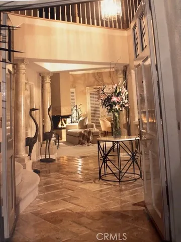 a view of a patio with table and chairs