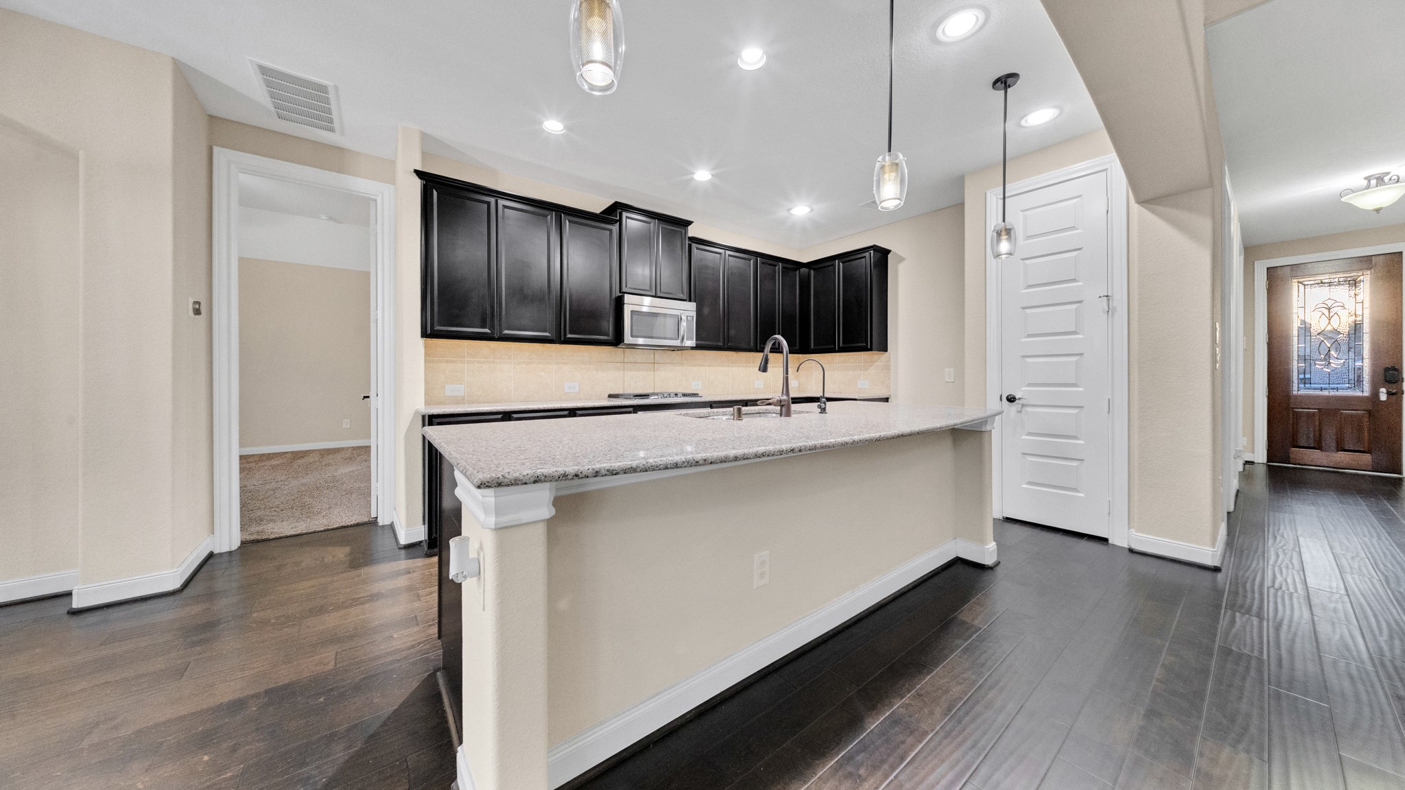 18118 Berry Garden Lane Spring, TX 77379 - Photo 16 of 45 a bathroom with a sink a mirror and a glass door shower