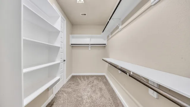 a view of an empty walk in closet