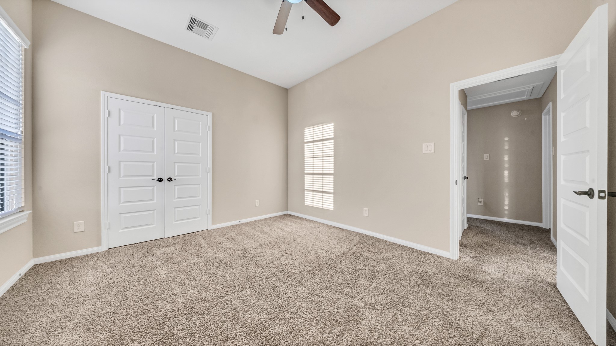 18118 Berry Garden Lane Spring, TX 77379 - Photo 35 of 45 an empty room with closet and windows
