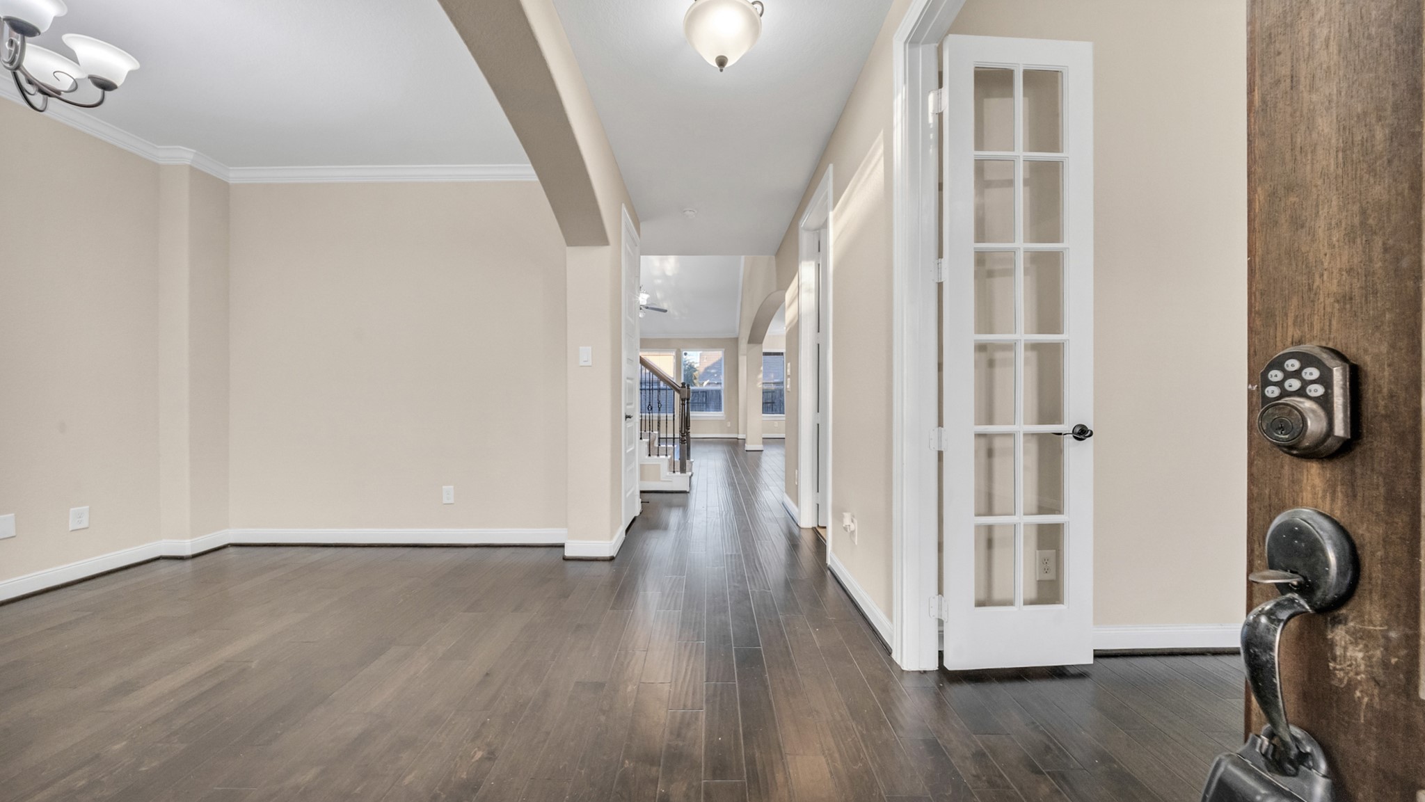 18118 Berry Garden Lane Spring, TX 77379 - Photo 4 of 45 a view of a hallway with wooden floor and staircase