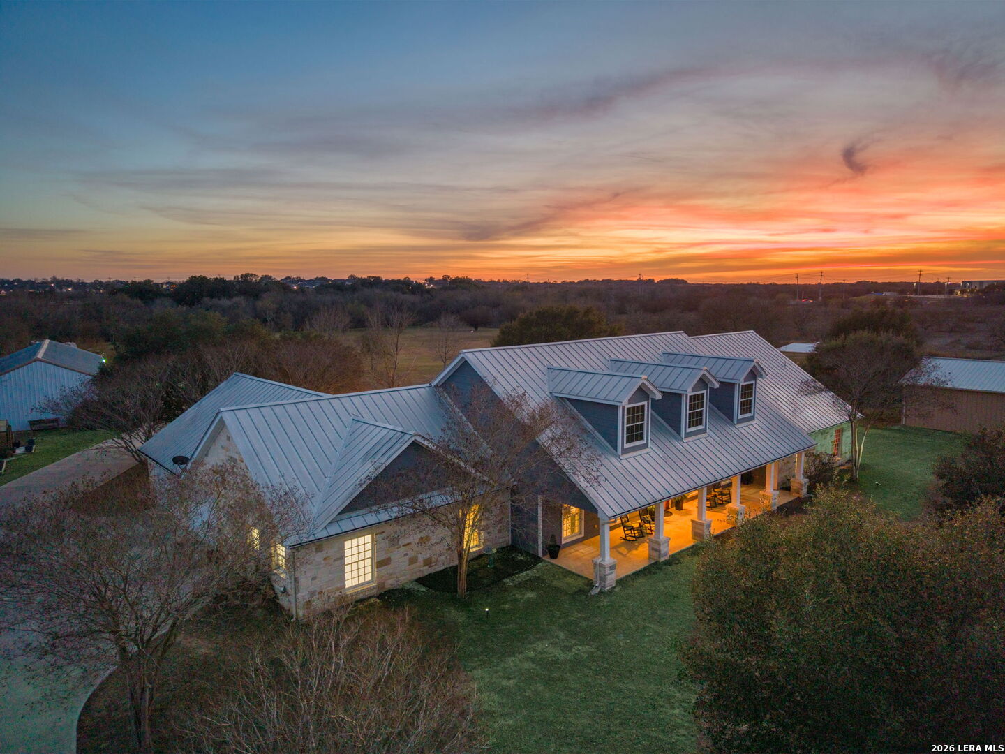 a view of a big house with a big yard next to a road