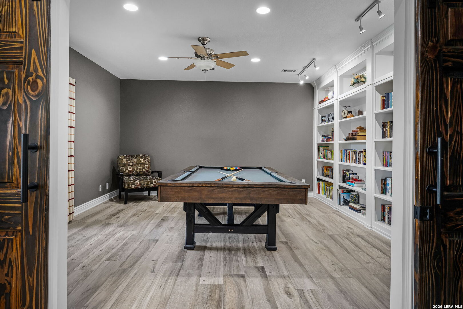12700 Woman Hollering Road Schertz, TX 78154 - Photo 12 of 45 a room with furniture and wooden floor