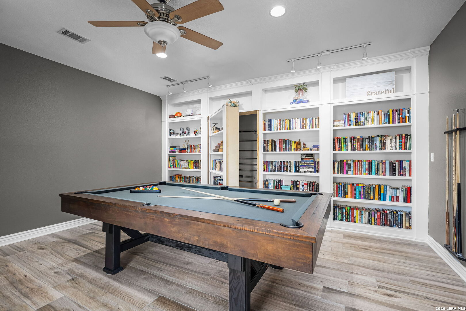 12700 Woman Hollering Road Schertz, TX 78154 - Photo 13 of 45 a view of a work space with furniture window and wooden floor