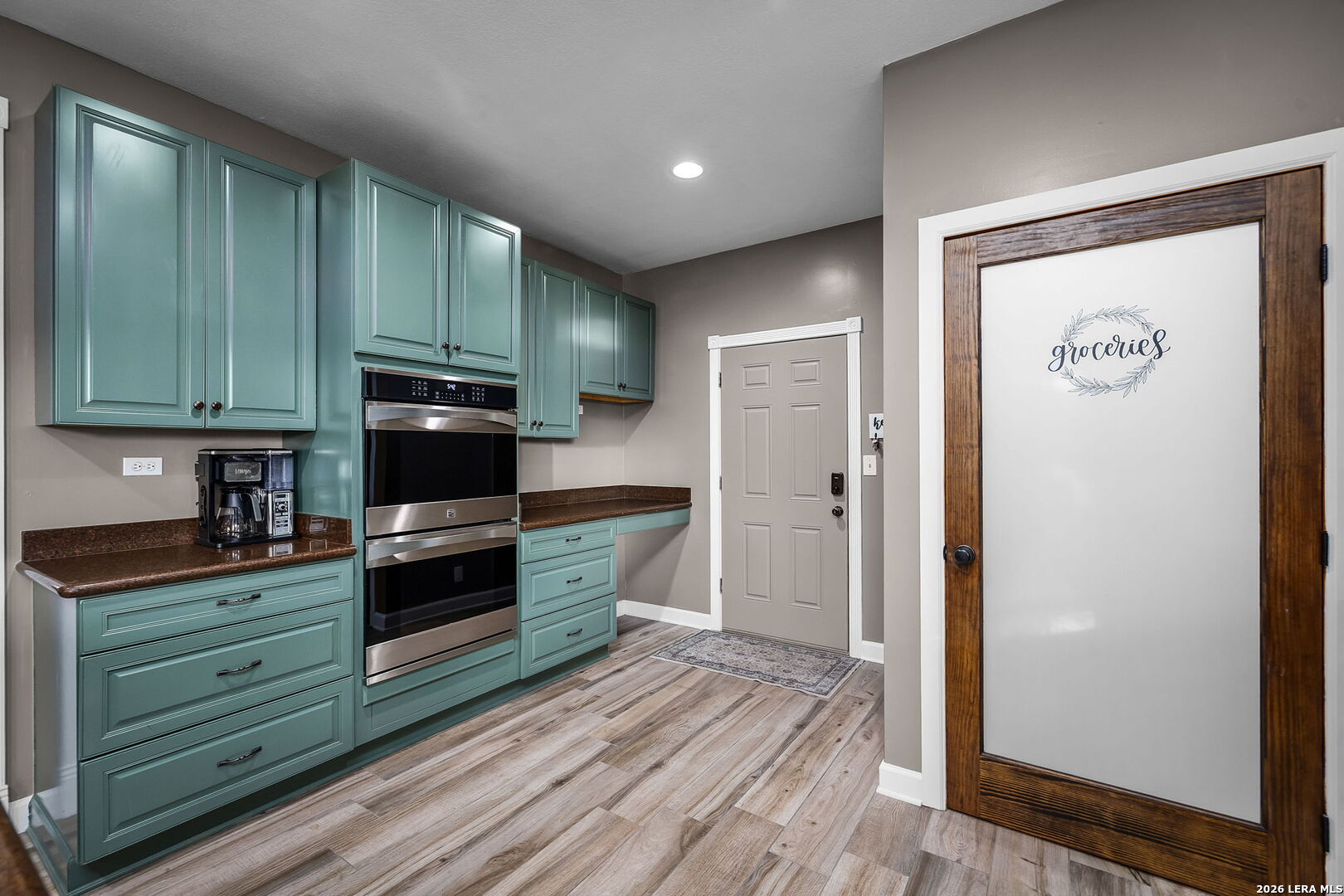 12700 Woman Hollering Road Schertz, TX 78154 - Photo 21 of 45 a kitchen with stainless steel appliances granite countertop a refrigerator and a stove