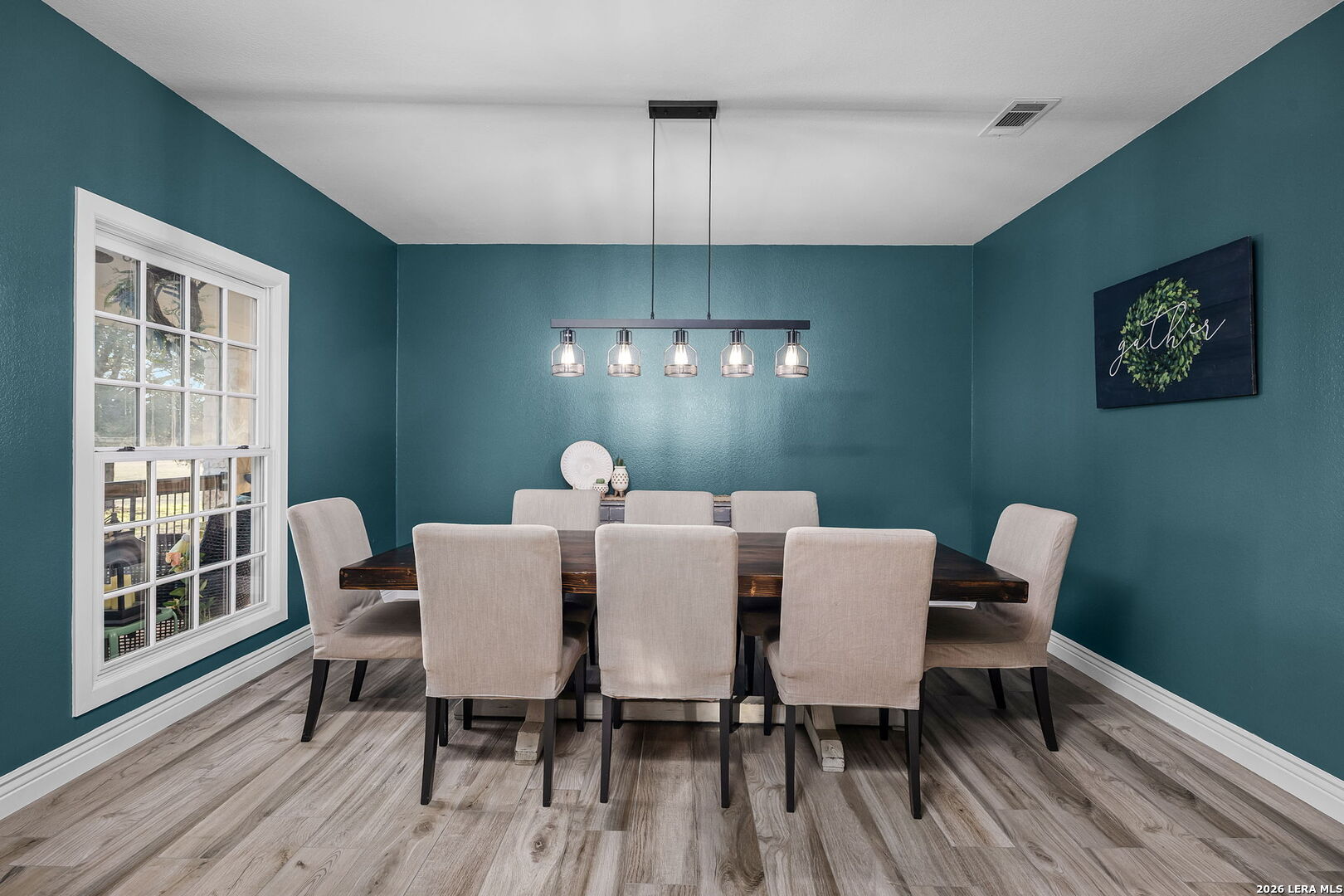 12700 Woman Hollering Road Schertz, TX 78154 - Photo 24 of 45 a view of a dining room with furniture window and wooden floor