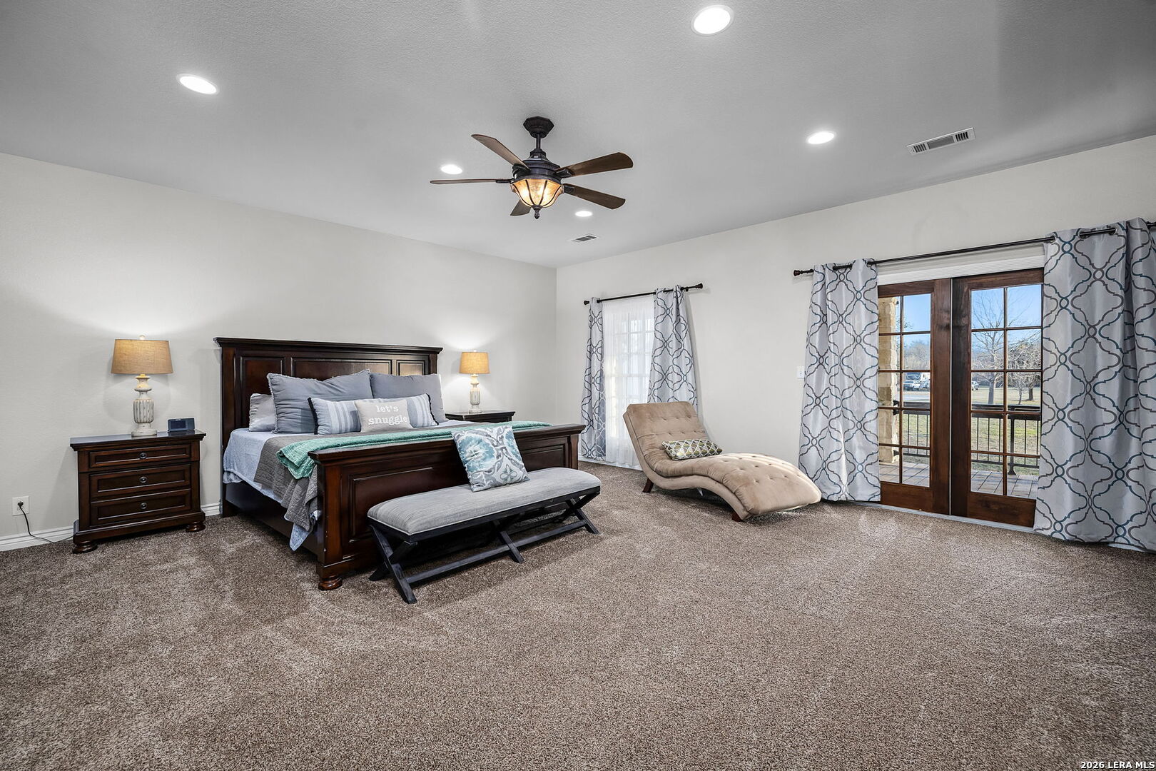 12700 Woman Hollering Road Schertz, TX 78154 - Photo 26 of 45 a bedroom with furniture and a large window