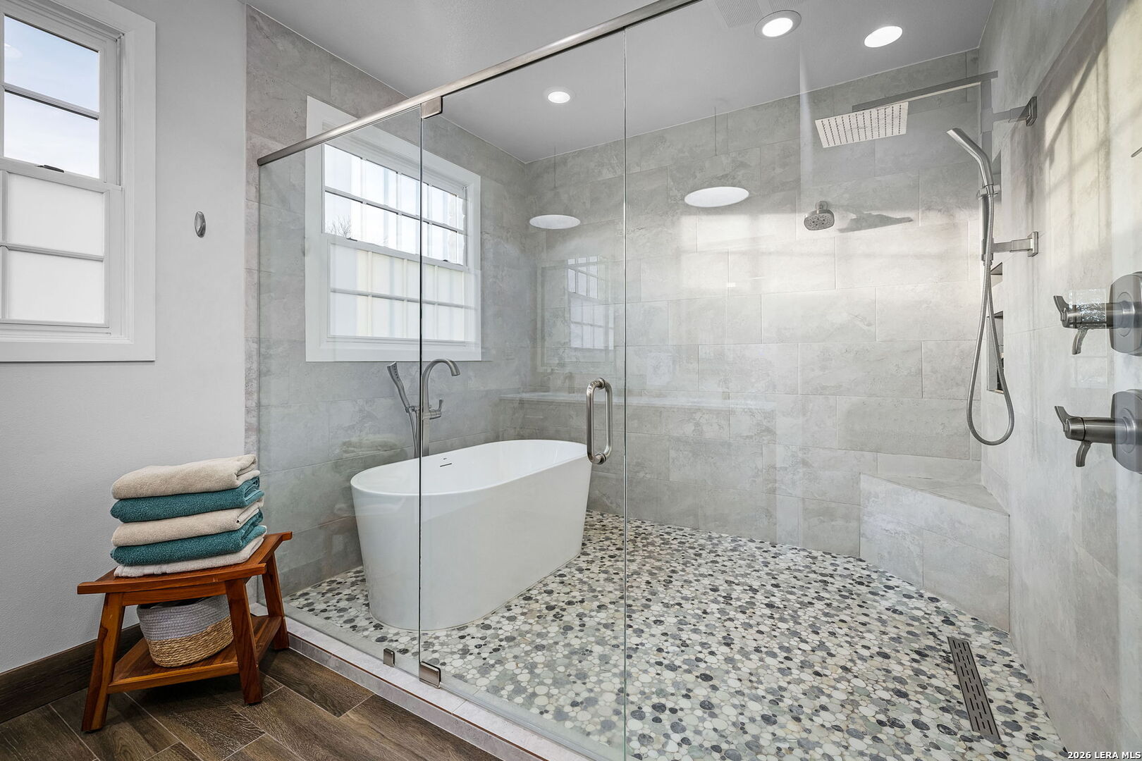 12700 Woman Hollering Road Schertz, TX 78154 - Photo 29 of 45 a bathroom with a sink a toilet and shower