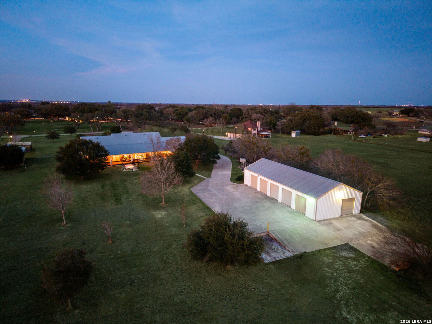12700 Woman Hollering Road Schertz, TX 78154 - Photo 3 of 45 a view of a lake in front of house with a yard
