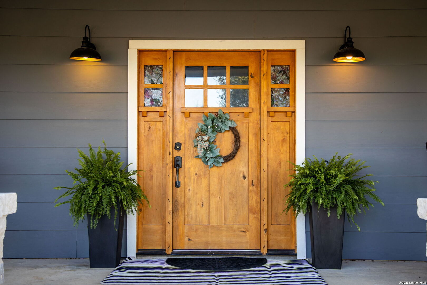 12700 Woman Hollering Road Schertz, TX 78154 - Photo 7 of 45 a potted plant in front of a door