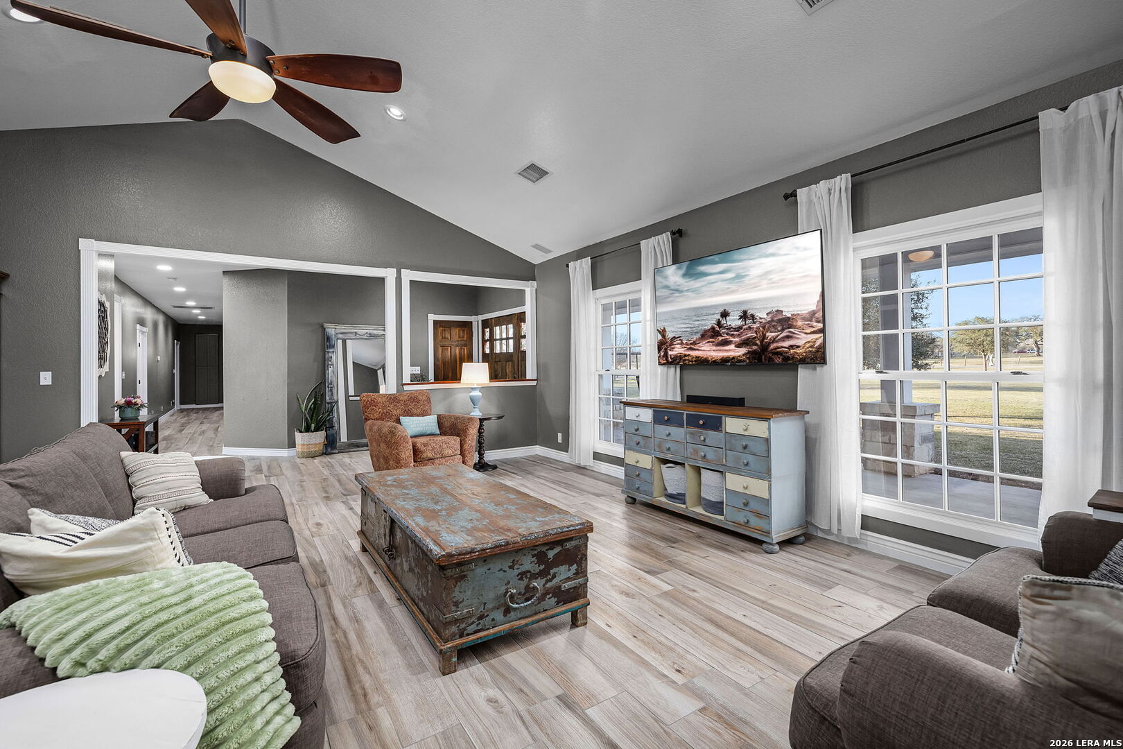 12700 Woman Hollering Road Schertz, TX 78154 - Photo 10 of 45 a living room with furniture and a flat screen tv