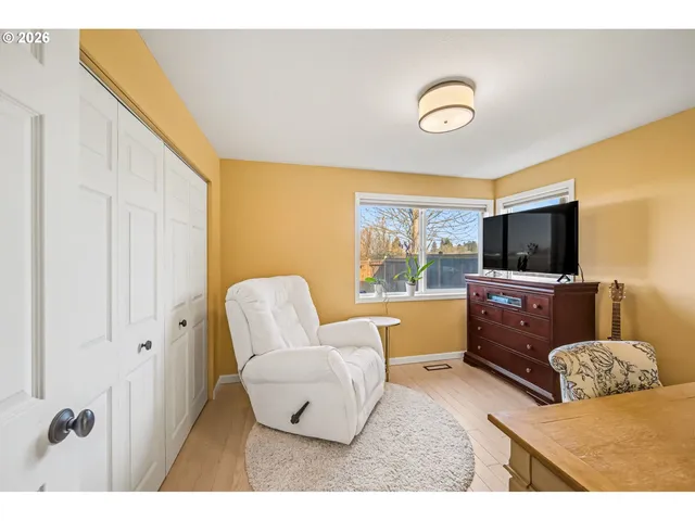 a living room with couches and a flat screen tv