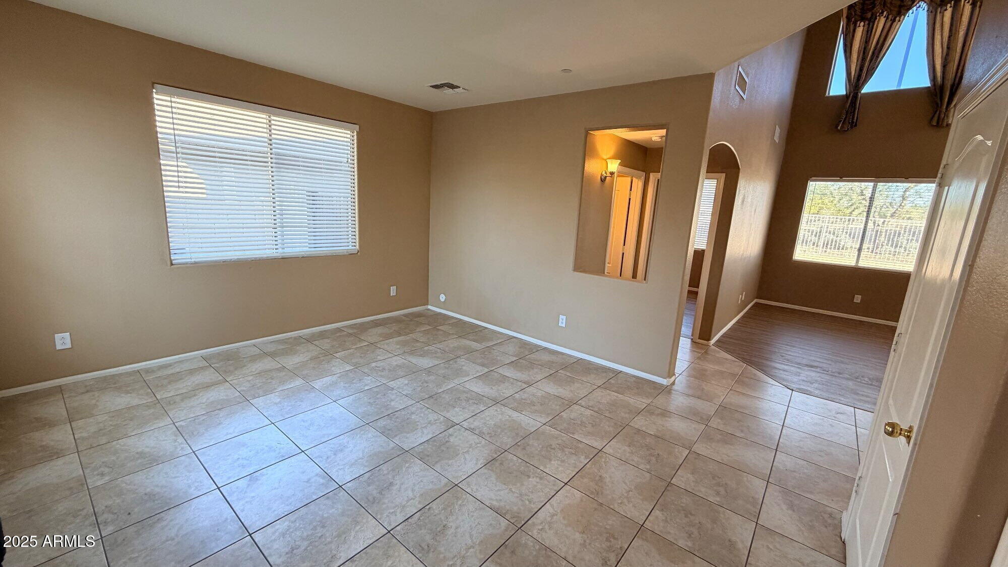 21549 Backus Drive Maricopa, AZ 85138 - Photo 2 of 28 a view of an empty room with a window
