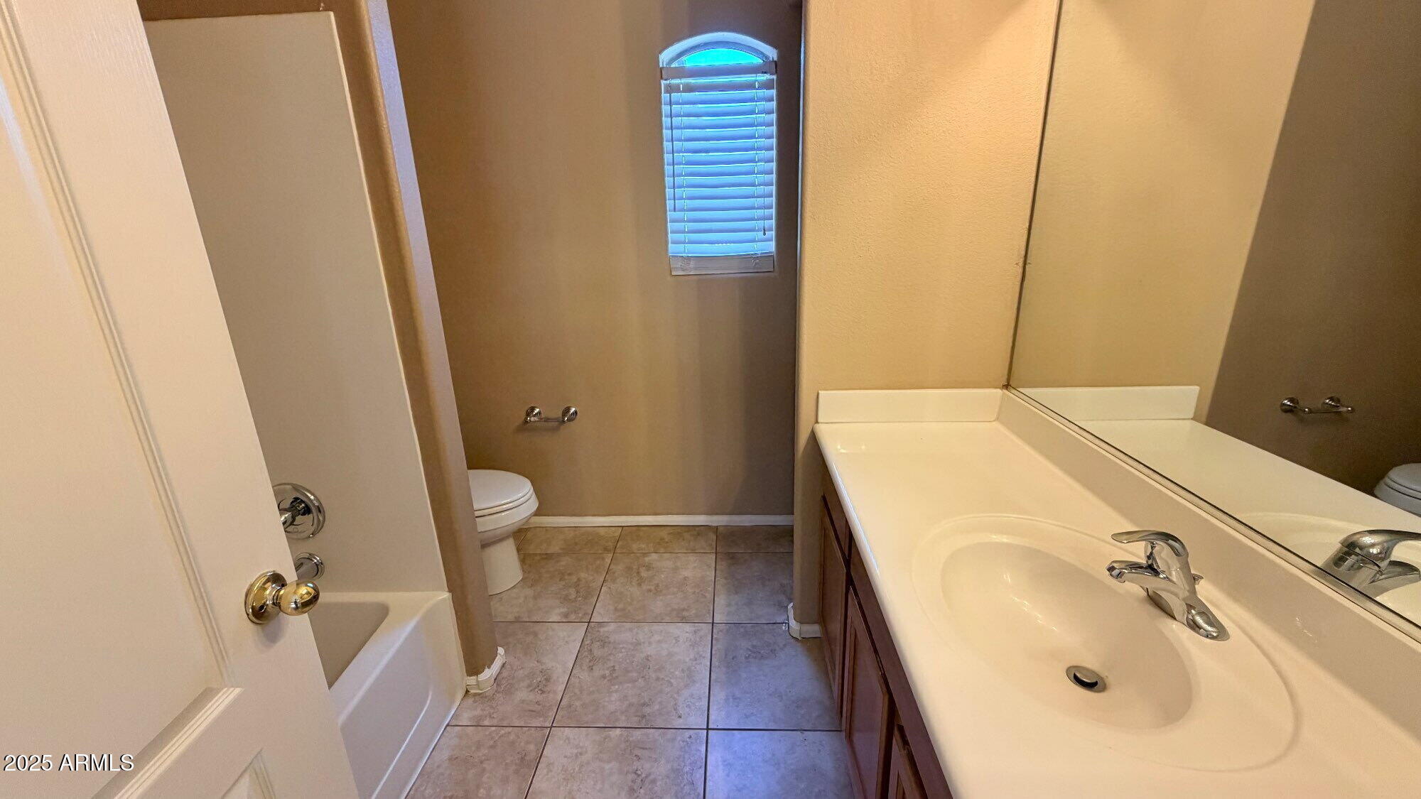 21549 Backus Drive Maricopa, AZ 85138 - Photo 21 of 28 a bathroom with a sink and a shower