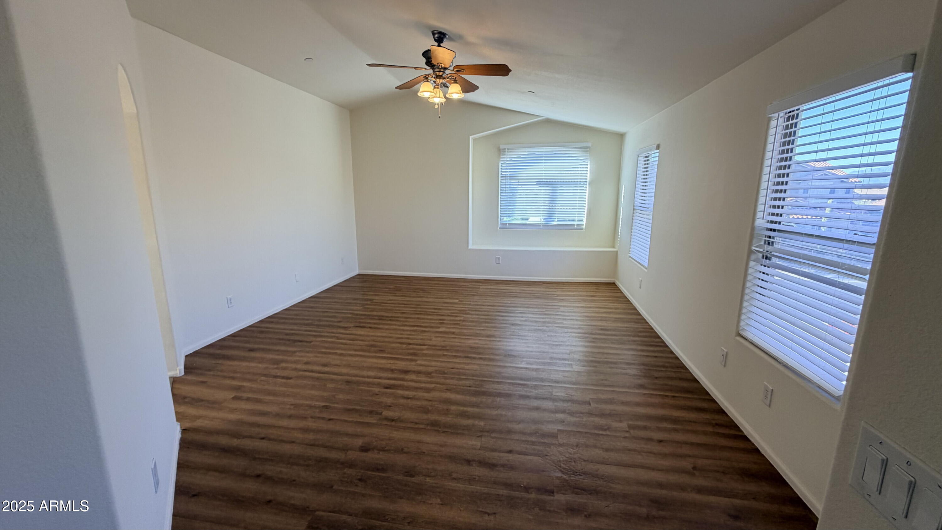 21549 Backus Drive Maricopa, AZ 85138 - Photo 22 of 28 wooden floor in an empty room with a window