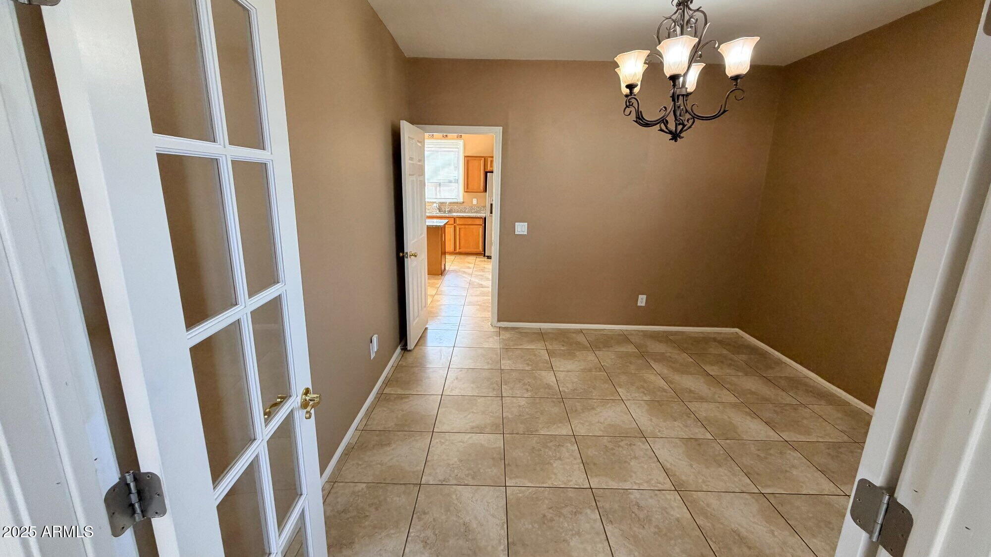 21549 Backus Drive Maricopa, AZ 85138 - Photo 3 of 28 a view of empty room with wooden floor and fan