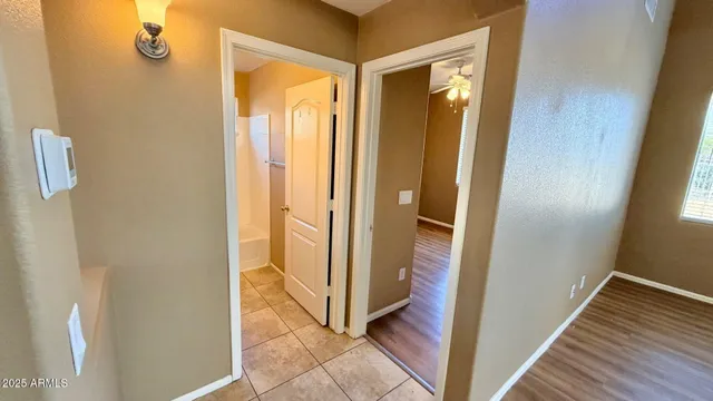 a view of a bathroom from a hallway