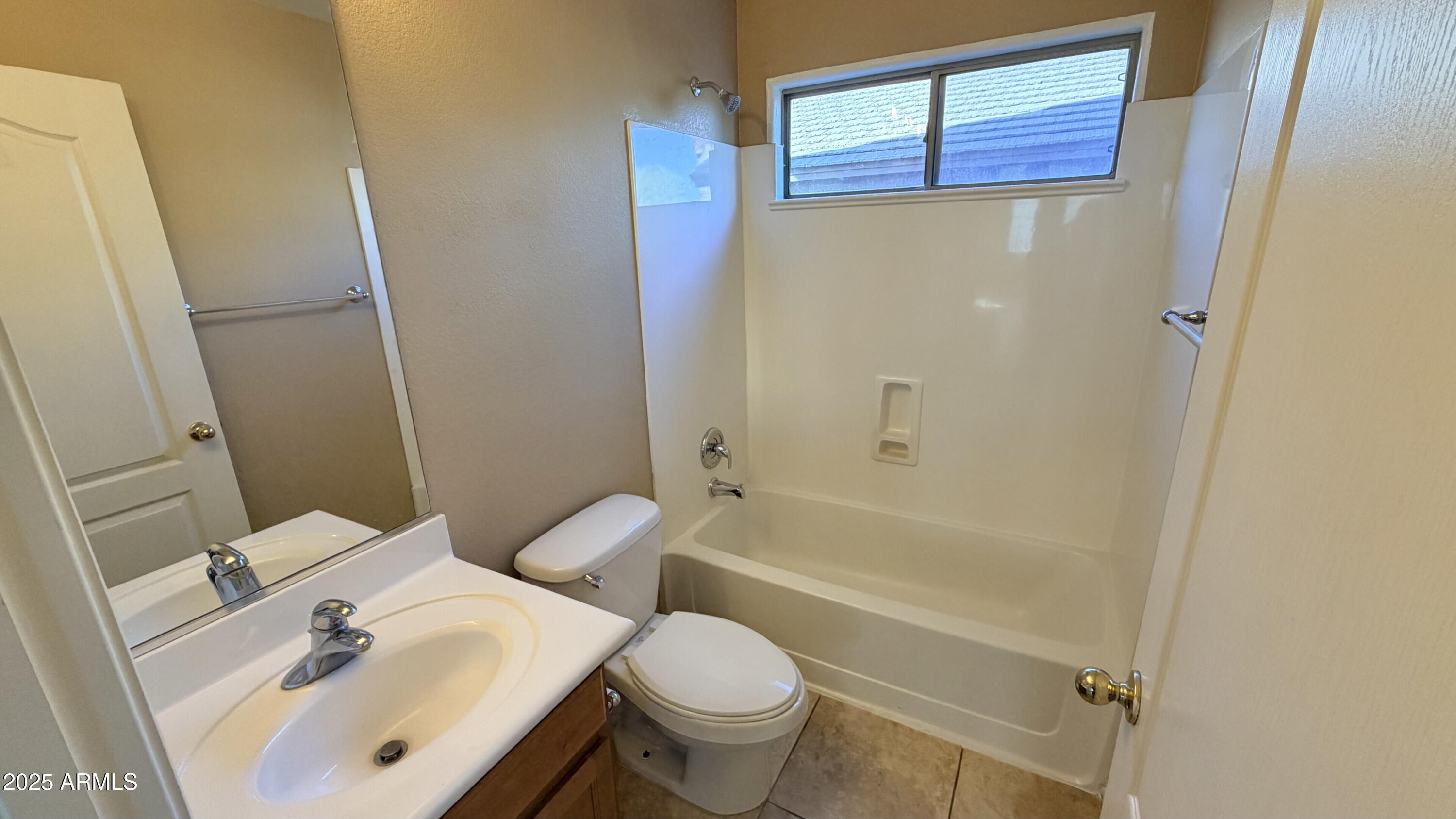21549 Backus Drive Maricopa, AZ 85138 - Photo 7 of 28 a bathroom with a sink toilet and shower
