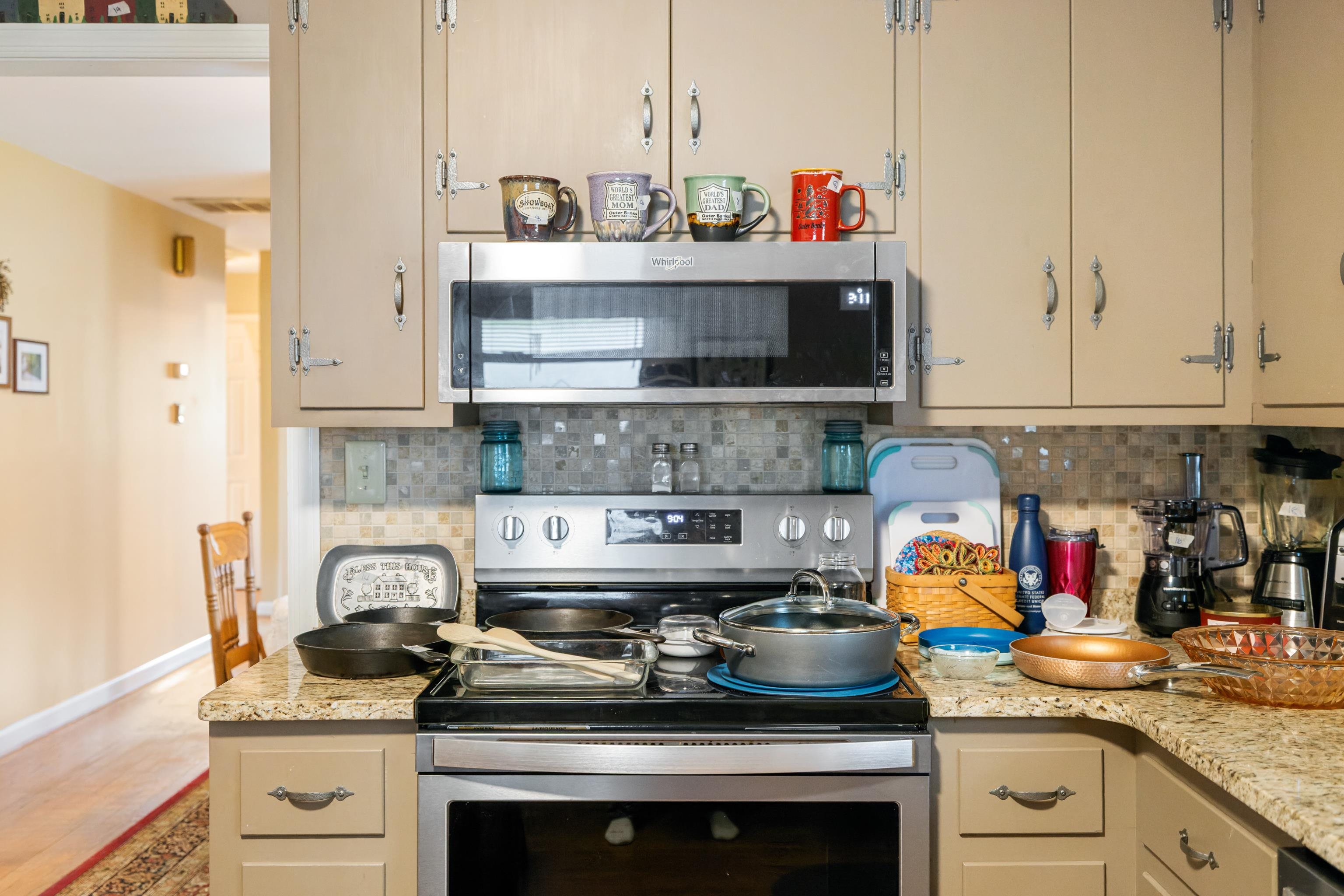 181 Ridge Street Lovingston, VA 22949 - Photo 19 of 56 a kitchen with stainless steel appliances granite countertop a stove and a white cabinets