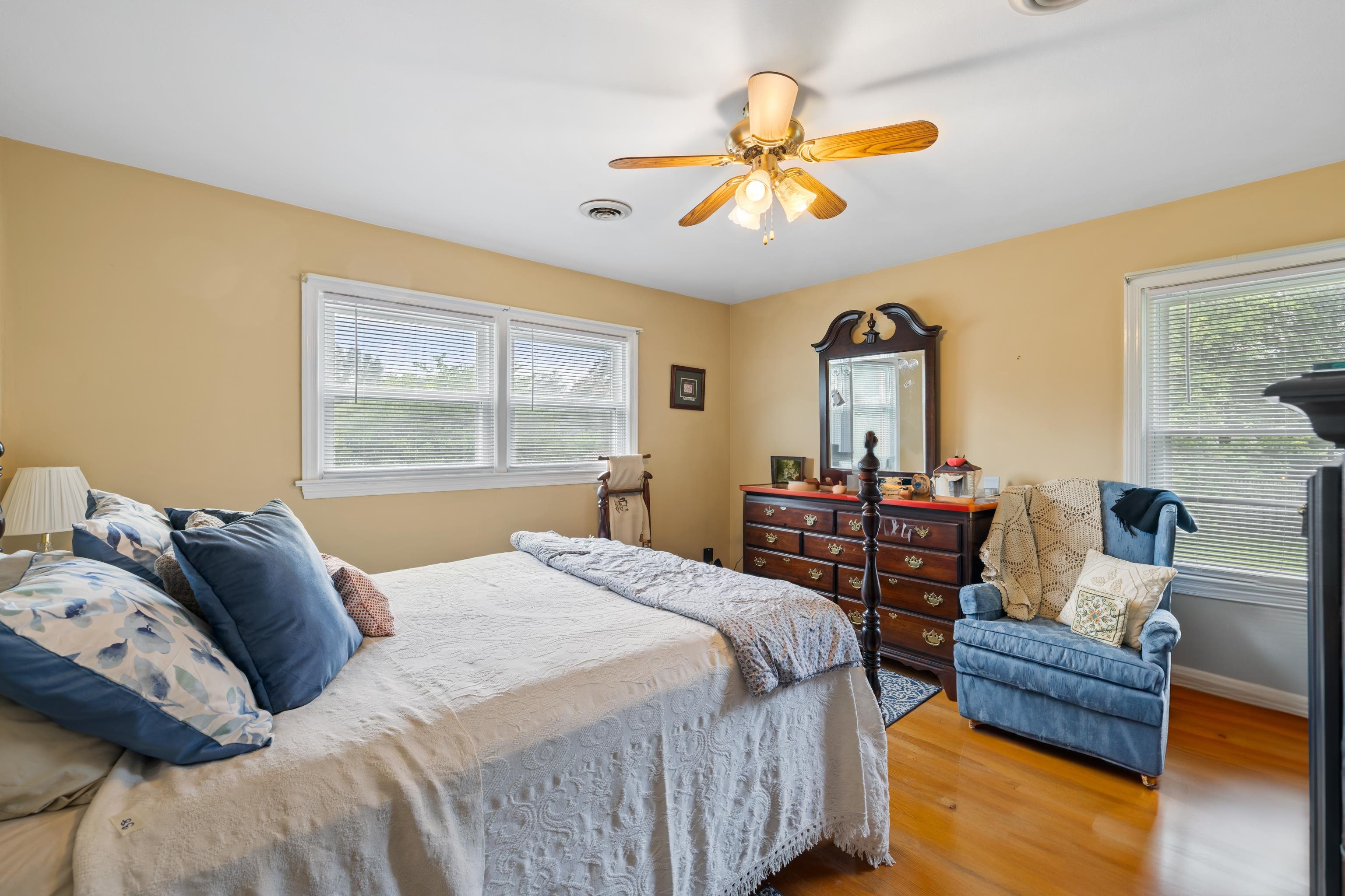 181 Ridge Street Lovingston, VA 22949 - Photo 25 of 56 a bedroom with a bed and a chandelier