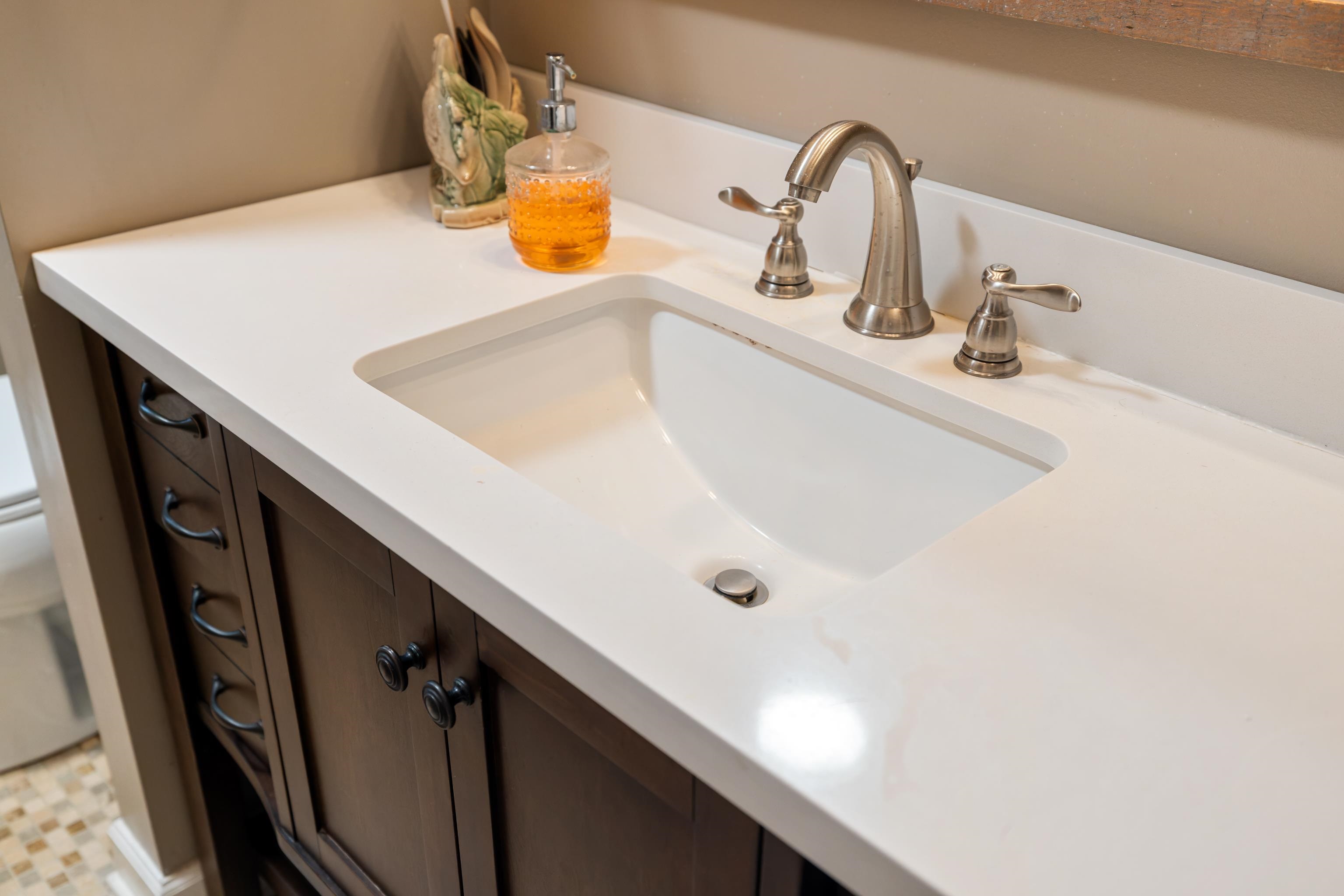 181 Ridge Street Lovingston, VA 22949 - Photo 28 of 56 a bathroom with a sink and a mirror