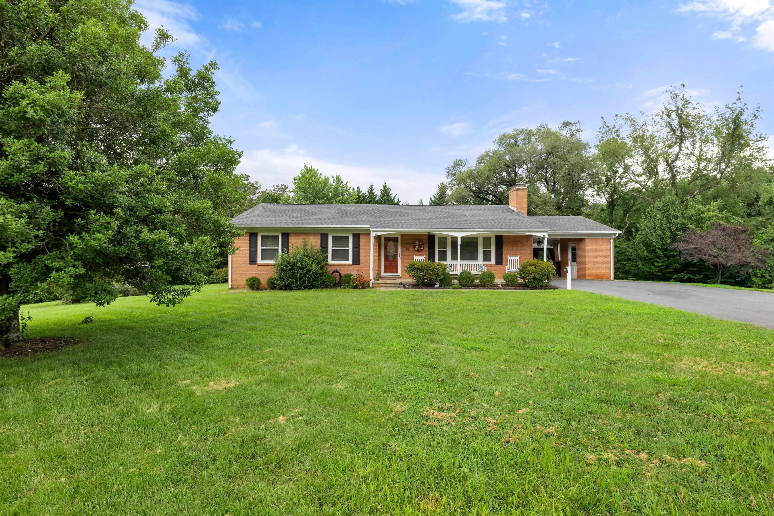 181 Ridge Street Lovingston, VA 22949 - Photo 4 of 56 a front view of house with yard and green space