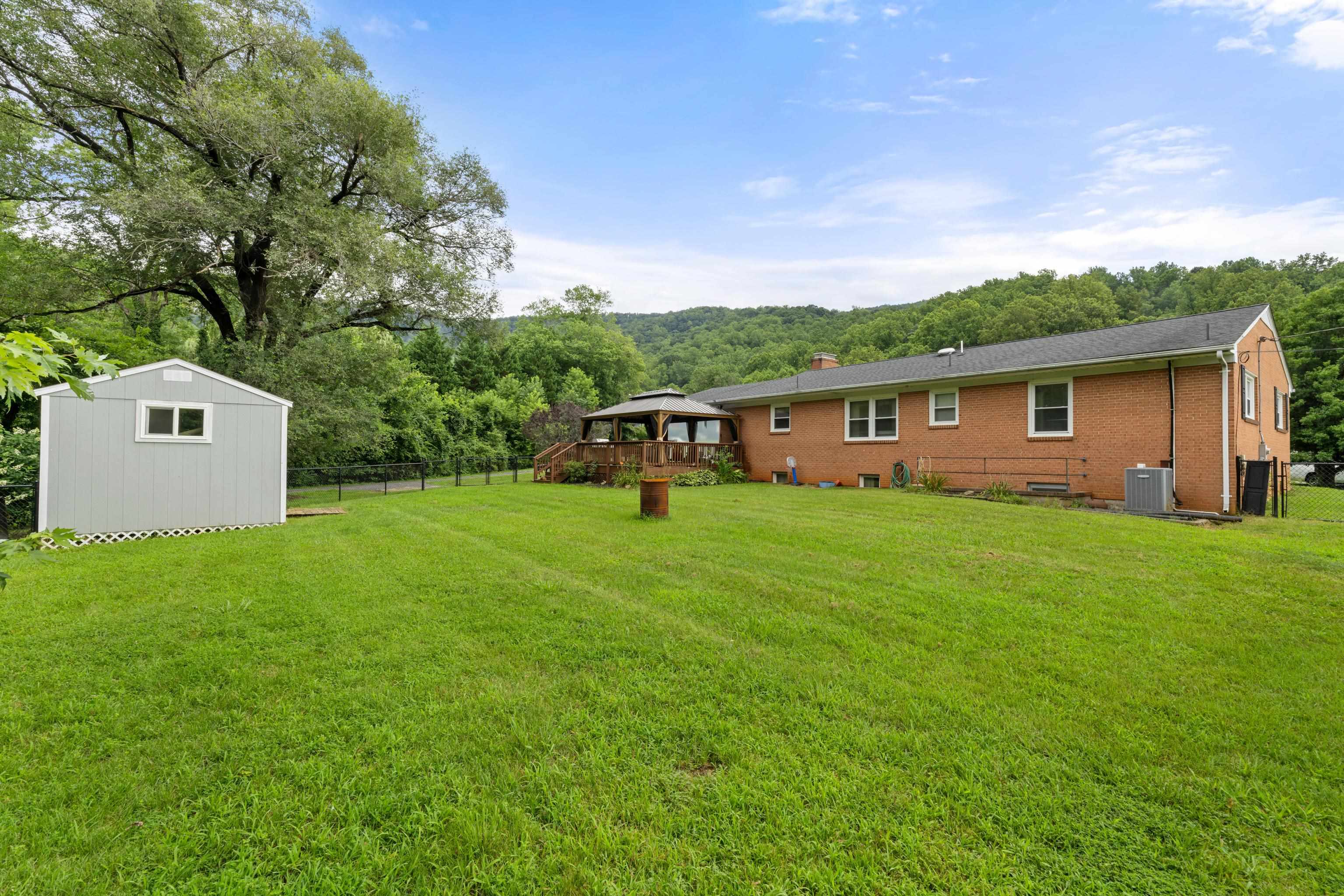 181 Ridge Street Lovingston, VA 22949 - Photo 45 of 56 a front view of house with a garden