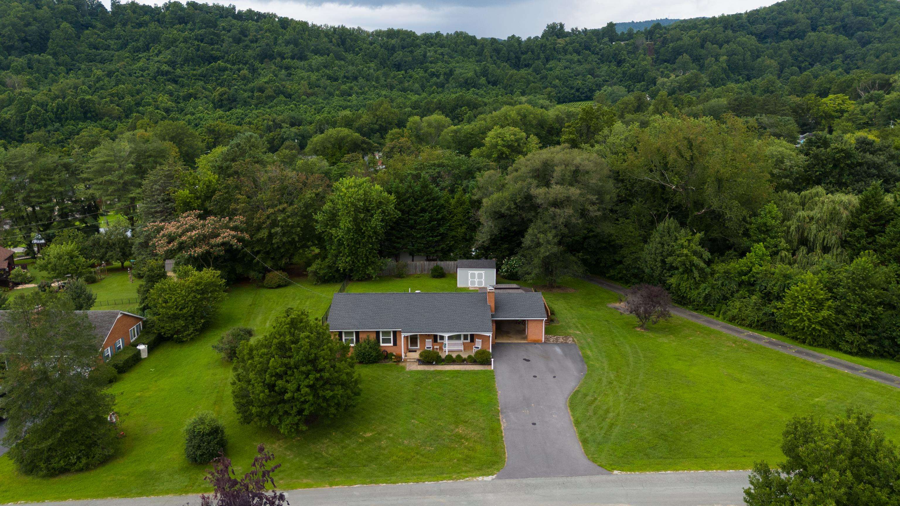 181 Ridge Street Lovingston, VA 22949 - Photo 49 of 56 an aerial view of a house with a yard
