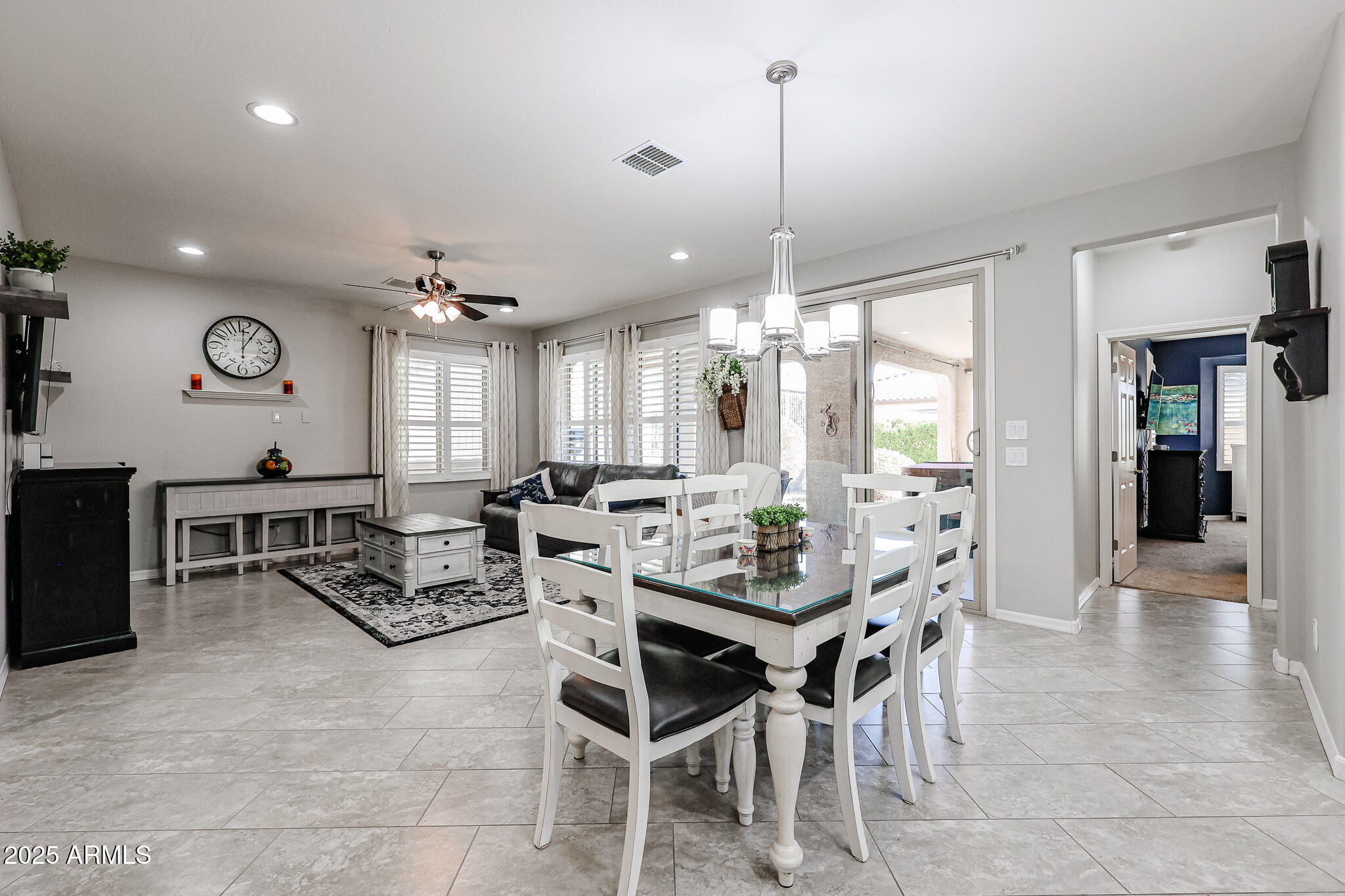 17563 West Fairview Street Goodyear, AZ 85338 - Photo 13 of 66 a view of a dining room with furniture