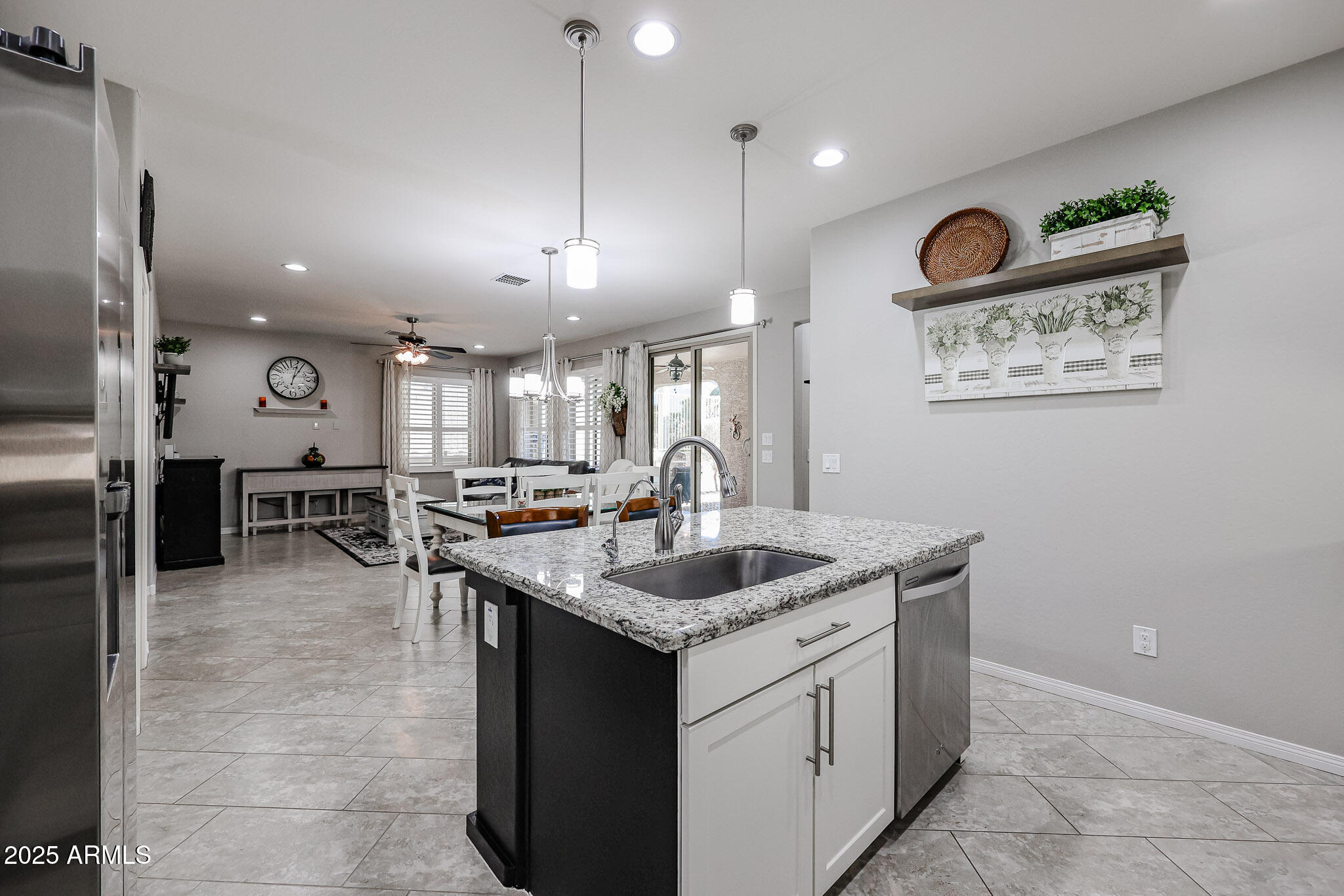 17563 West Fairview Street Goodyear, AZ 85338 - Photo 17 of 66 a kitchen with a sink a counter top space appliances and a view of kitchen