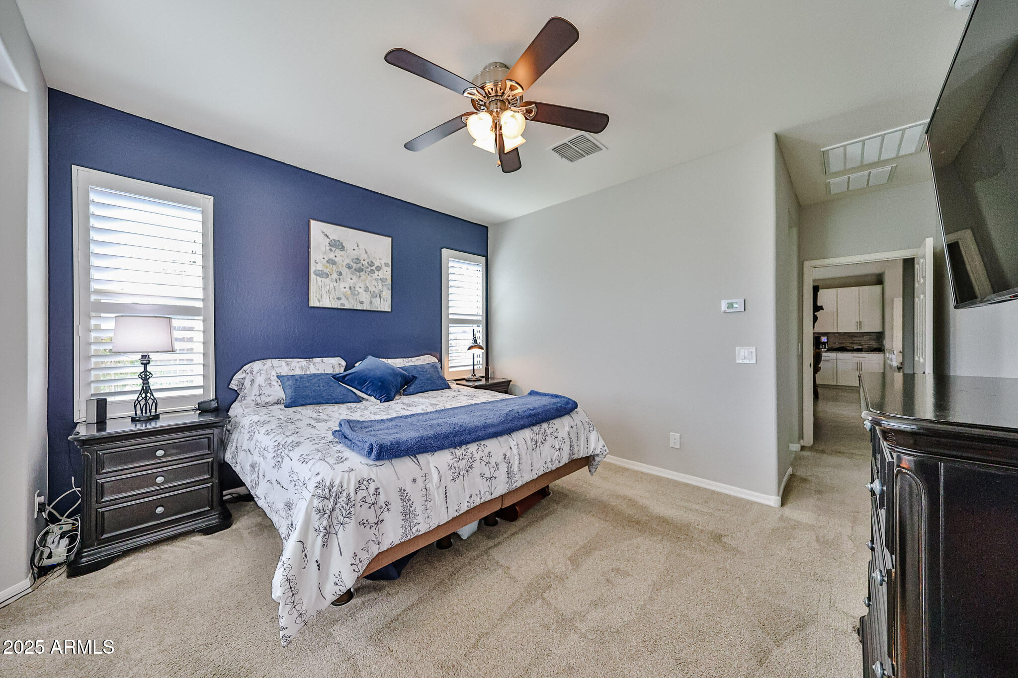 17563 West Fairview Street Goodyear, AZ 85338 - Photo 23 of 66 a bedroom with a bed furniture and a large window