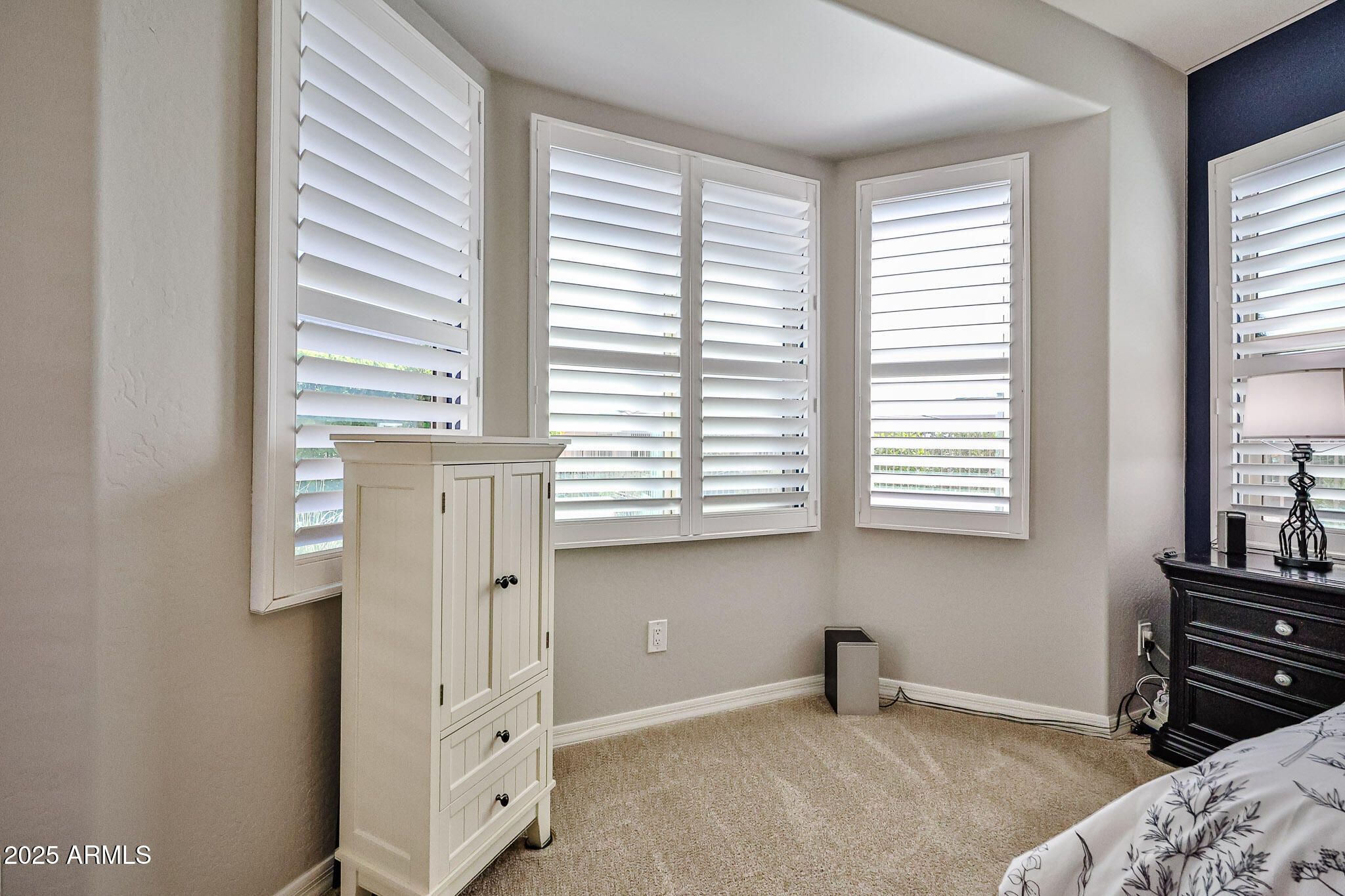 17563 West Fairview Street Goodyear, AZ 85338 - Photo 25 of 66 a bedroom with windows and closet