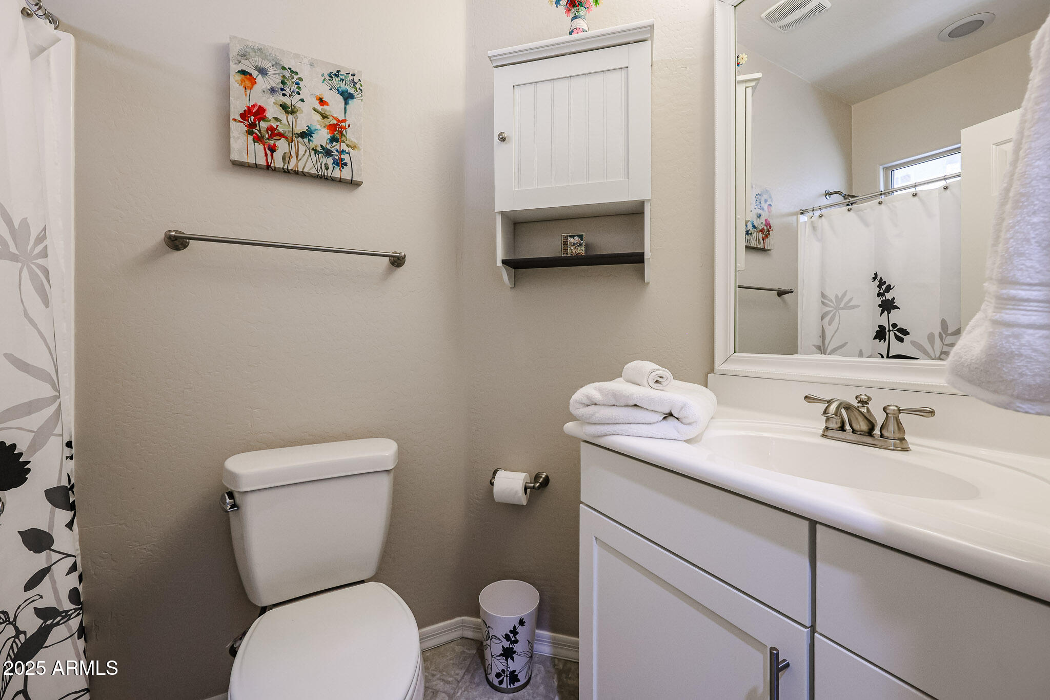 17563 West Fairview Street Goodyear, AZ 85338 - Photo 28 of 66 a bathroom with a toilet sink and mirror