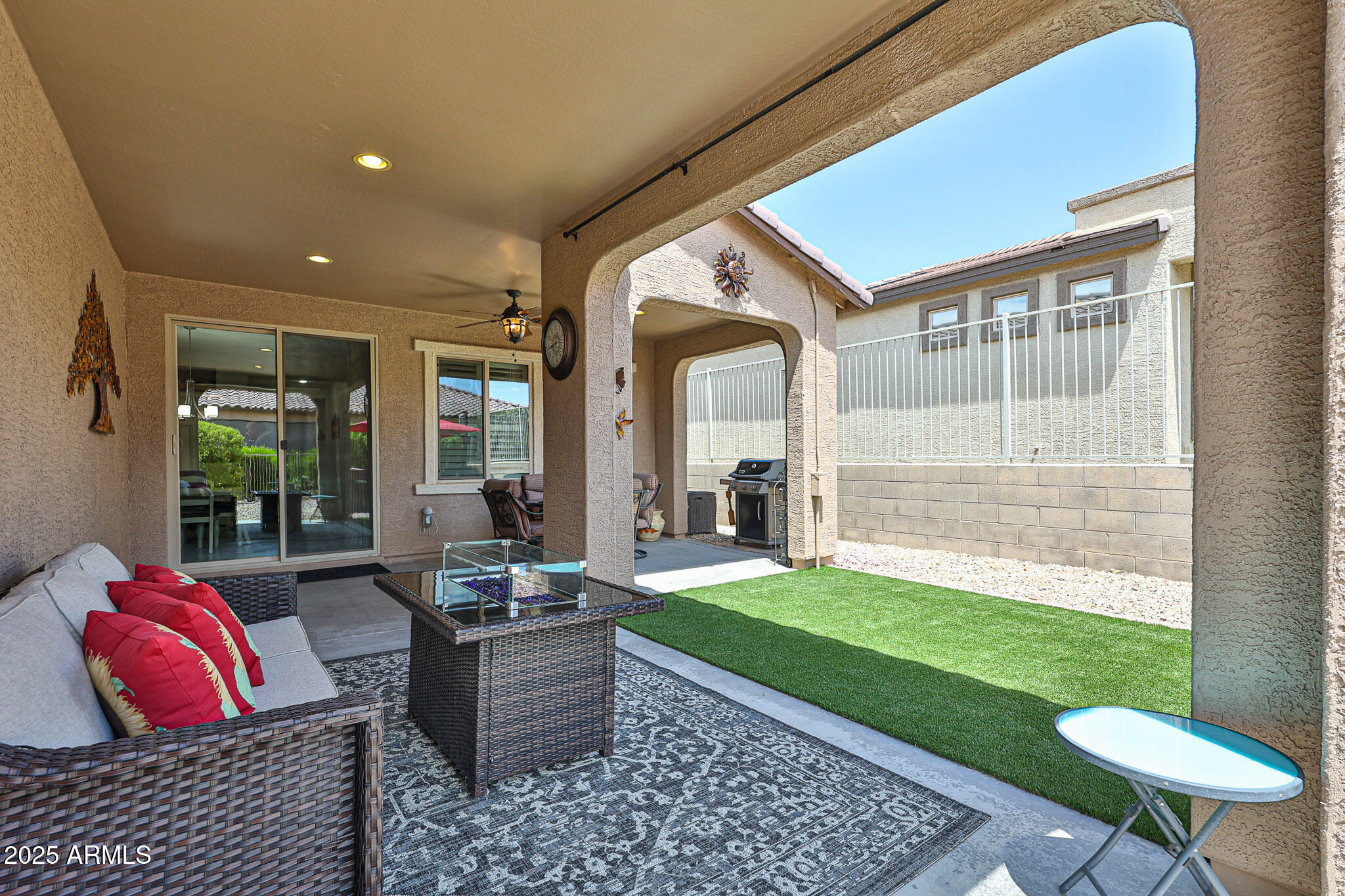 17563 West Fairview Street Goodyear, AZ 85338 - Photo 36 of 66 a living room with furniture and a rug