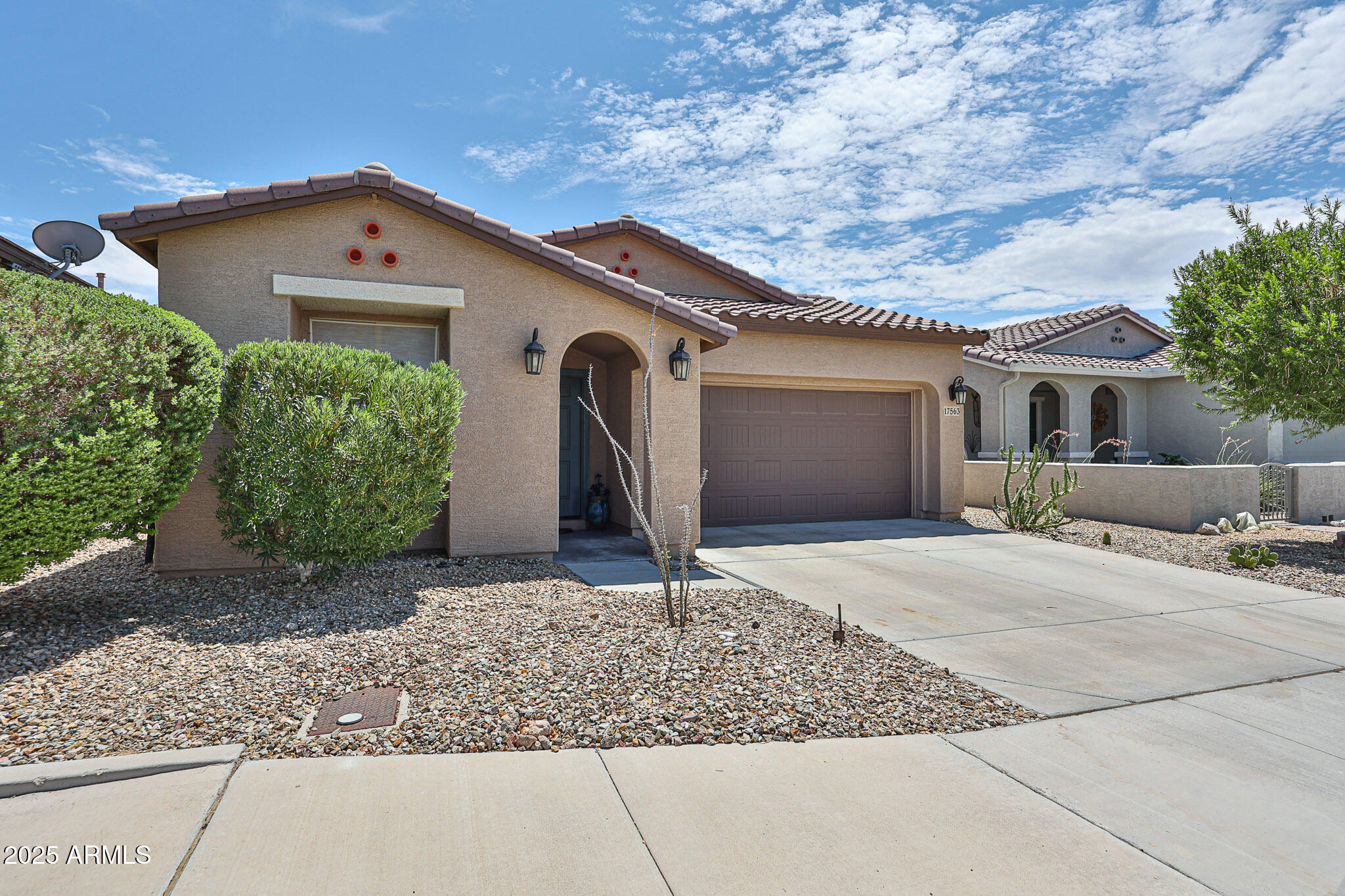 17563 West Fairview Street Goodyear, AZ 85338 - Photo 5 of 66 a front view of a house with garden