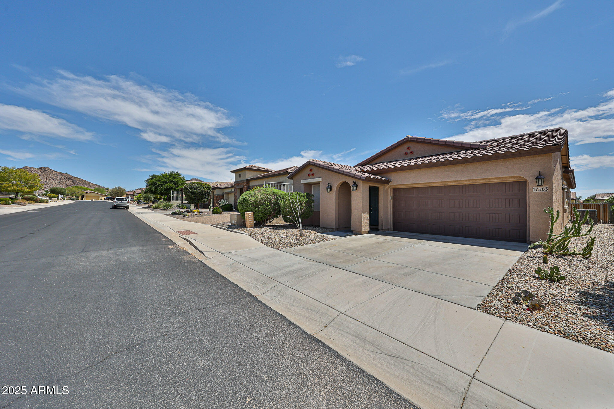 17563 West Fairview Street Goodyear, AZ 85338 - Photo 6 of 66 a view of a house with a street