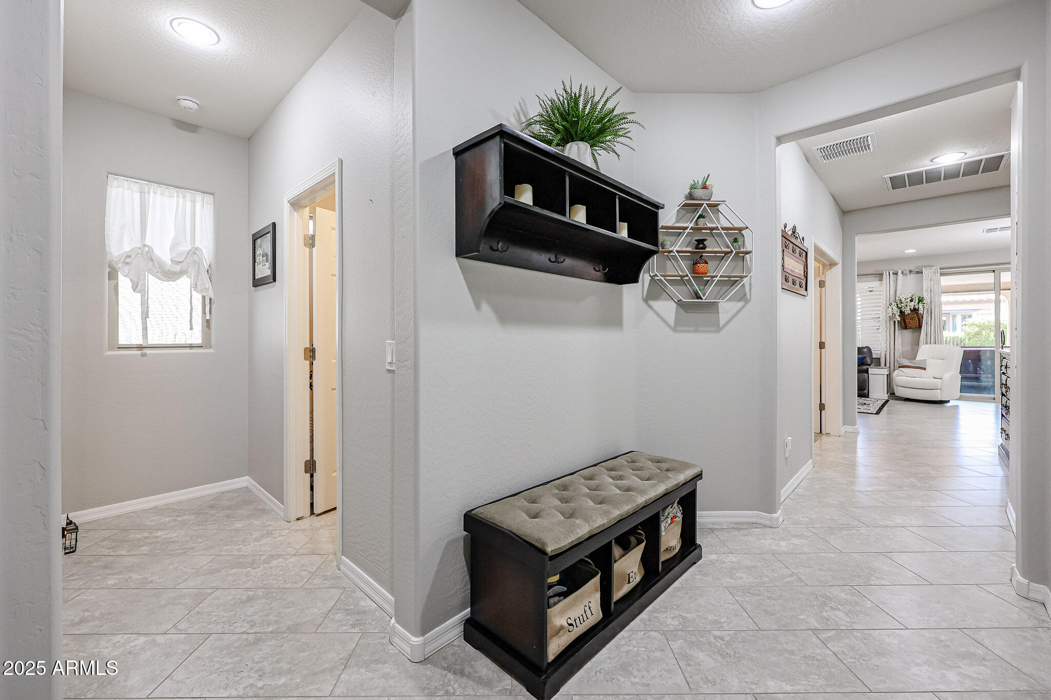 17563 West Fairview Street Goodyear, AZ 85338 - Photo 7 of 66 a view of a livingroom with furniture and flat screen tv