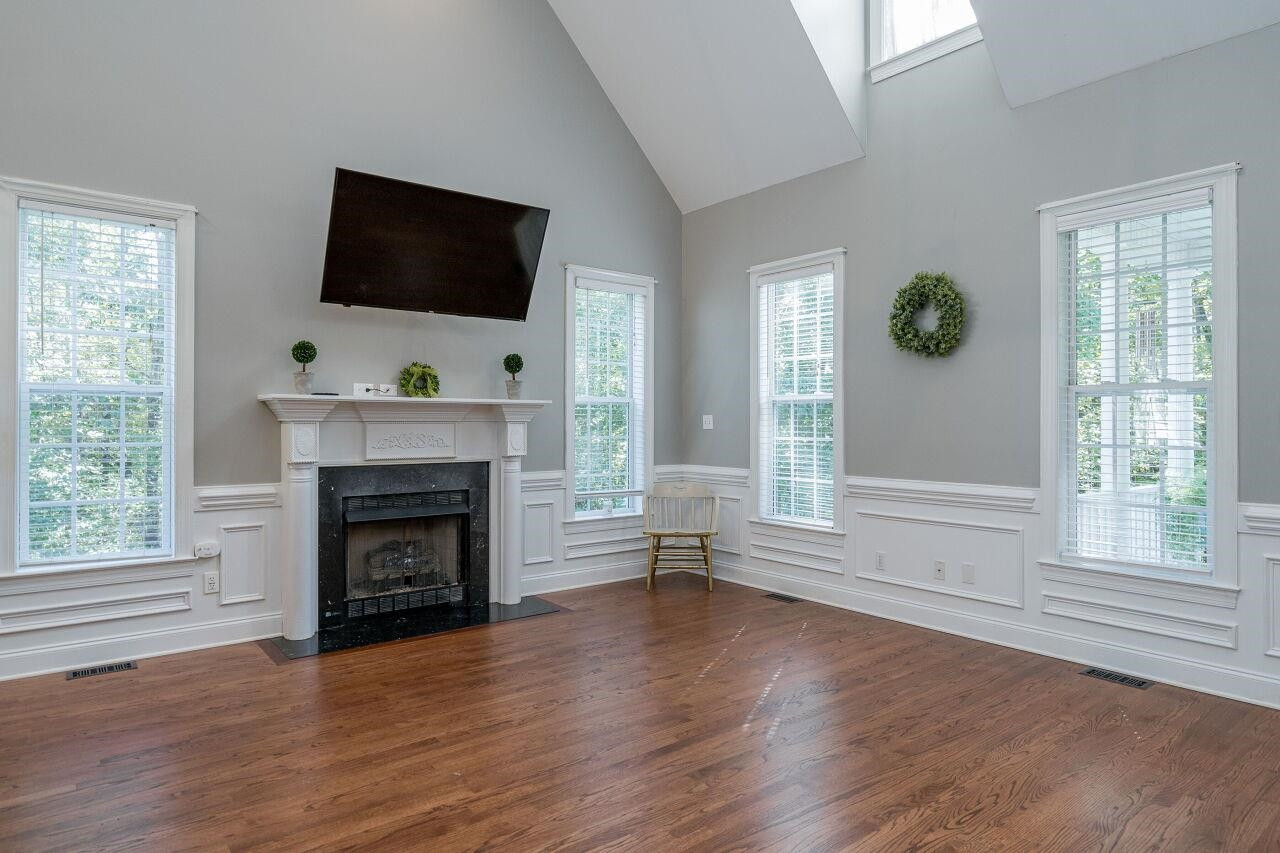 2152 Christian Light Road Fuquay-Varina, NC 27526 - Photo 5 of 30 Friends and family will enjoy spending time by the fire on cool North Carolina days. Family Room