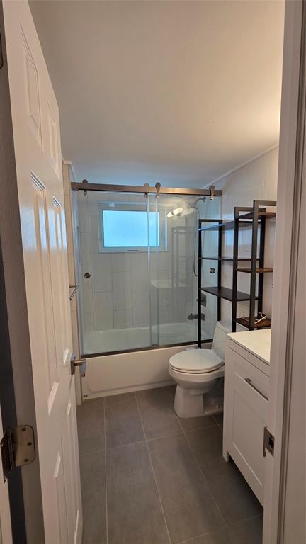 2607 Northeast 8th Avenue, Unit 14 Wilton Manors, FL 33334 - Photo 11 of 12 a bathroom with a toilet a sink and shower