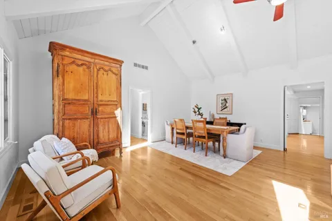 a living room with furniture a window and a table