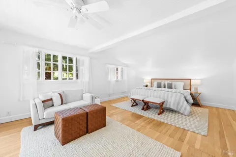 a bedroom with a large bed and a couch