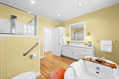 a bedroom with a bed dresser and a window