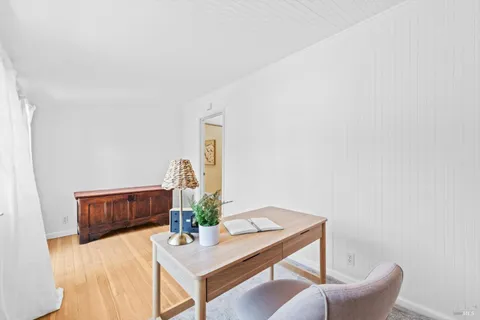 a view of a workspace with furniture