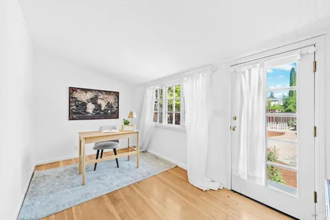 a living room with furniture and a window with outer view