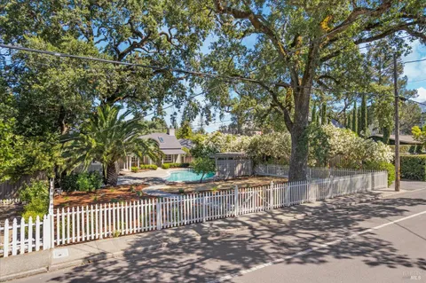 a view of a wrought iron fences in front of house