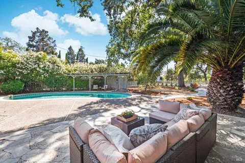 a view of swimming pool with seating space