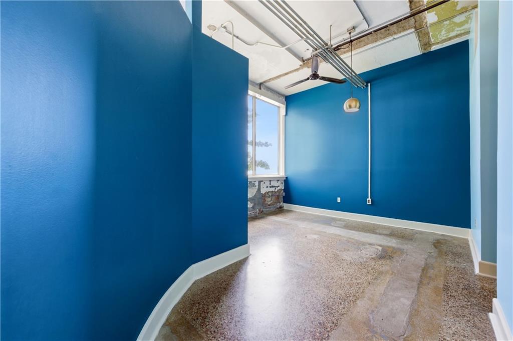 505 Whitehall Street Southwest, Unit 203 Atlanta, GA 30303 - Photo 13 of 36 a view of a livingroom with a ceiling fan and a window