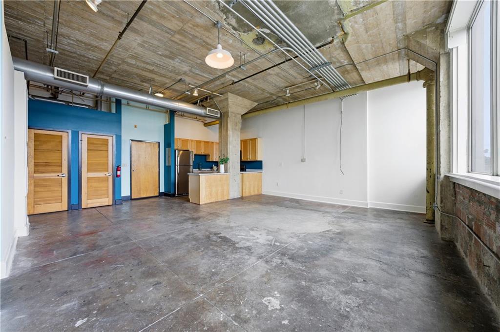 505 Whitehall Street Southwest, Unit 203 Atlanta, GA 30303 - Photo 4 of 36 a view of an empty room with a window