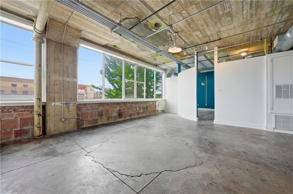505 Whitehall Street Southwest, Unit 203 Atlanta, GA 30303 - Photo 7 of 36 a view of an empty room with windows