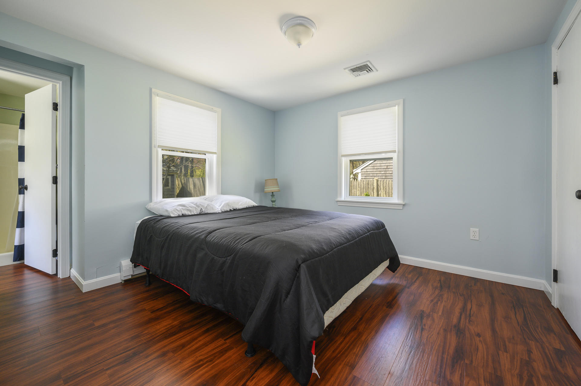 17 Farm Hill Road Centerville, MA 02632 - Photo 12 of 25 a spacious bedroom with a bed and a window